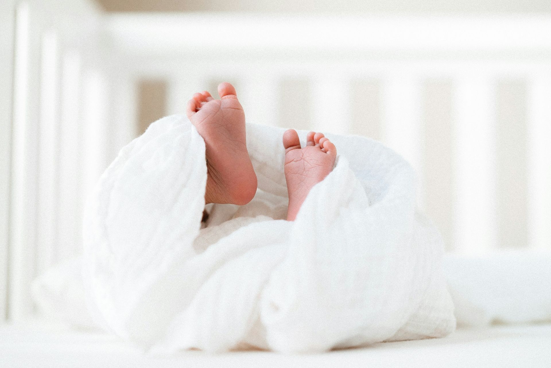 person covered with white blanket